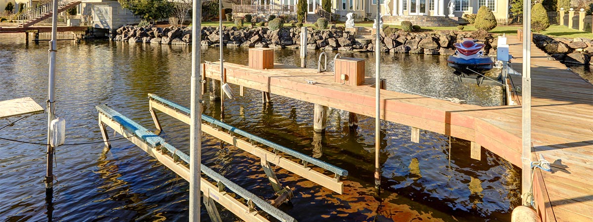 Mansion with a boat dock and motorized lift