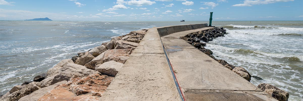 Seawall jetty in ocean water